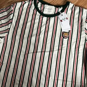 Men’s tshirt.  Striped with  a fun tiger embroidered patch.  Size large.  NWT